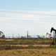 A photo of pumpjacks in an oilfield.